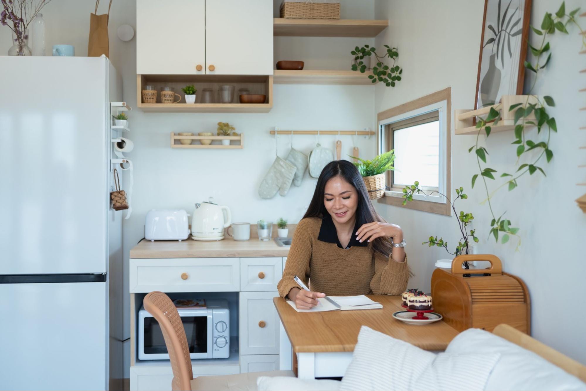 Small, bright apartment kitchen with minimal counter space, illustrating organized small-space living.