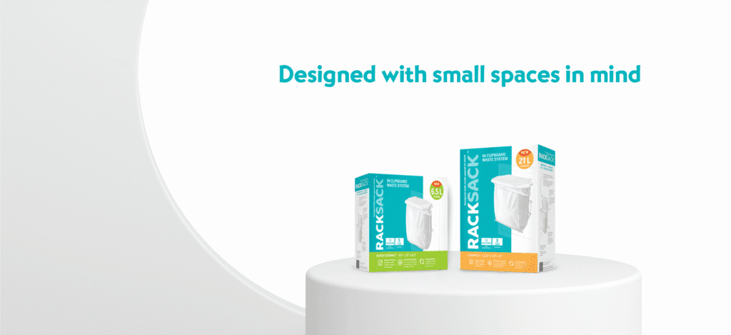 Two sizes of Rack Sack In-Cupboard Waste System products, the 15L Super Compact and 21L Compact, displayed on a pedestal under the text "Designed with small spaces in mind," showcasing the ultimate space-saving trash can options.