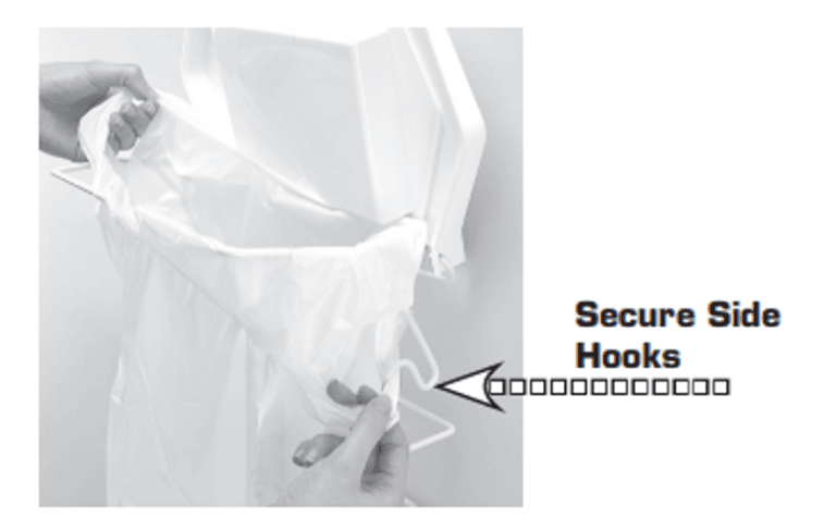 A black and white instructional photograph showing a white Rack Sack trash bag being fitted onto a Rack Sack in-cupboard waste frame. One hand stretches the bag's handle over the back corner, while another hand loops the side of the plastic bag around a built-in wire hook on the side of the rack. A graphic arrow points directly to the hook, accompanied by the text "Secure Side Hooks."