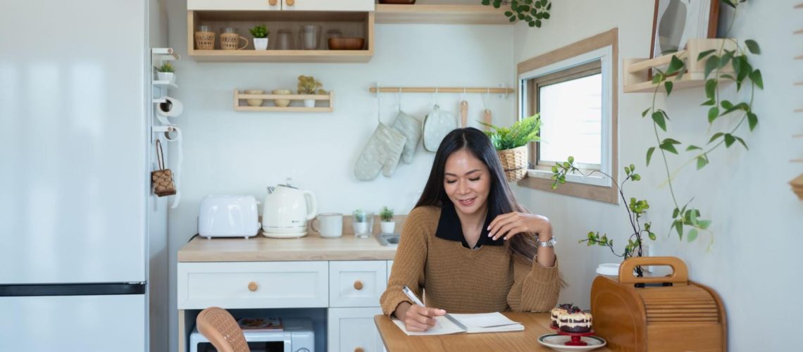 Small, bright apartment kitchen with minimal counter space, illustrating organized small-space living.